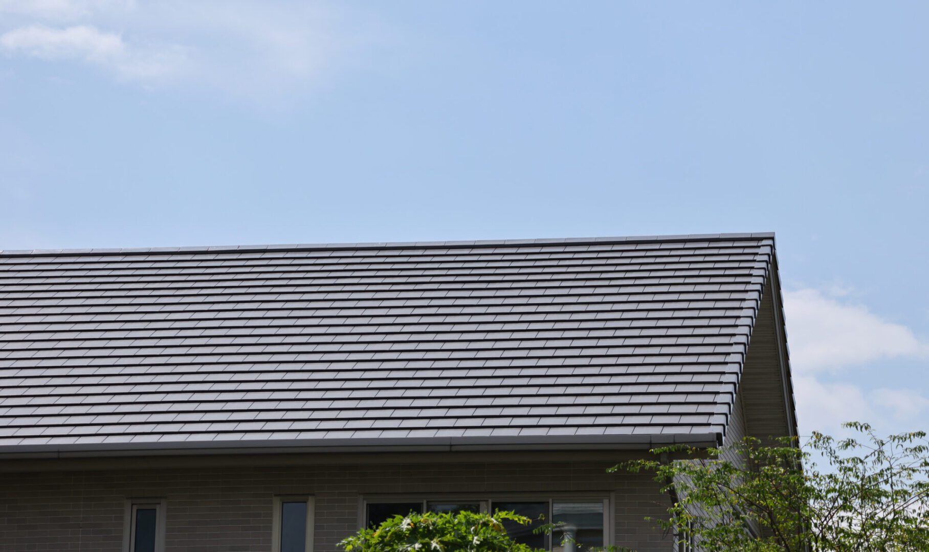 House roof under clear blue sky
