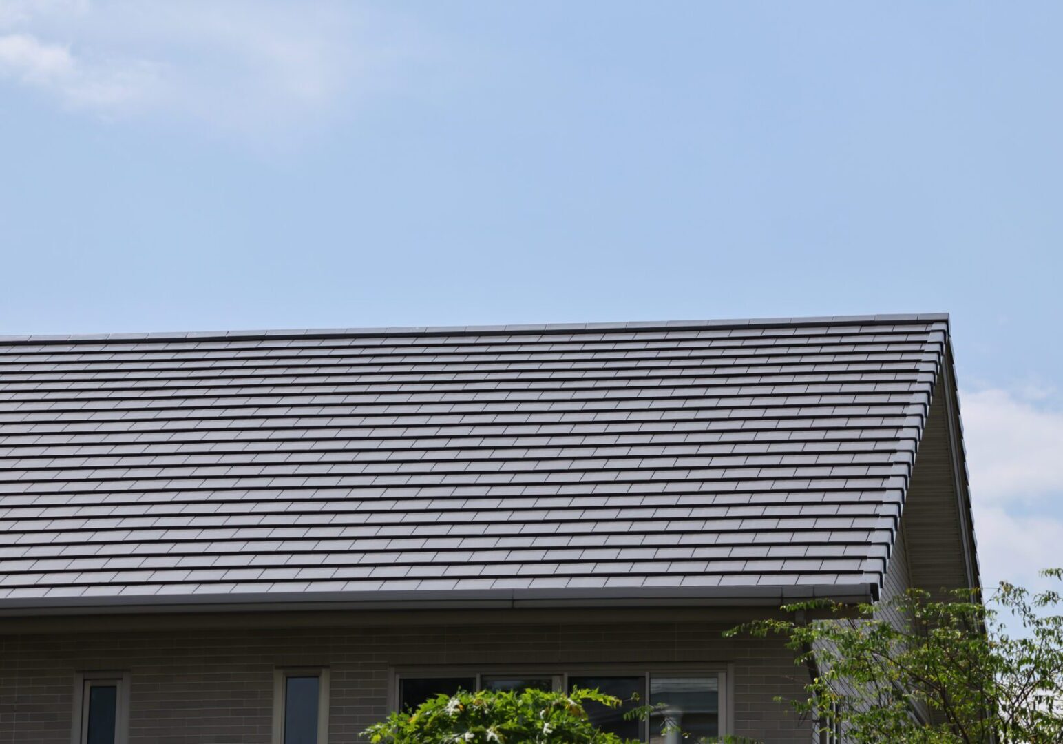 House roof under clear blue sky